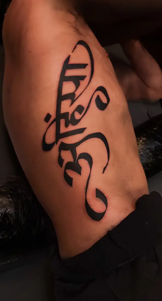 Sanskrit script tattoo
